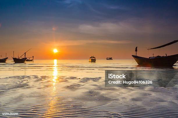 Boat In The Sea Under Sunset Stock Photo - Download Image Now - Above, Beach, Beauty In Nature