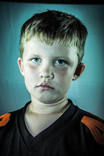 istock Young Boy in Football Jersey 459438151