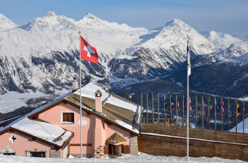 Building with swiss flag on the alpine skiing resort. St-Moritz, Switzerland