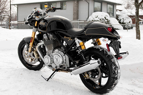 Black Norton Commando 961SE Fonthill, Ontario, Canada - December 15, 2013: A brand new 2013 Norton Commando 961 SE Dual Seat motorcycle poses outside in a driveway in the snow in Fonthill, Ontario Canada norton brand name stock pictures, royalty-free photos & images