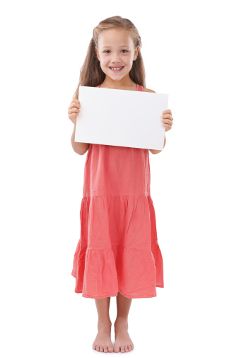 Full length shot of a young girl holding a blank sign for copyspace