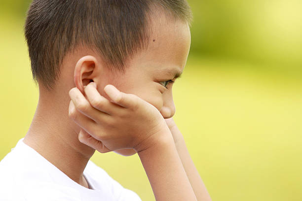 istock Cute little boy on a green meadow 459443621