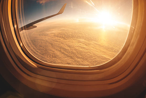 istock Sunlight from the porthole on airplane 459444199