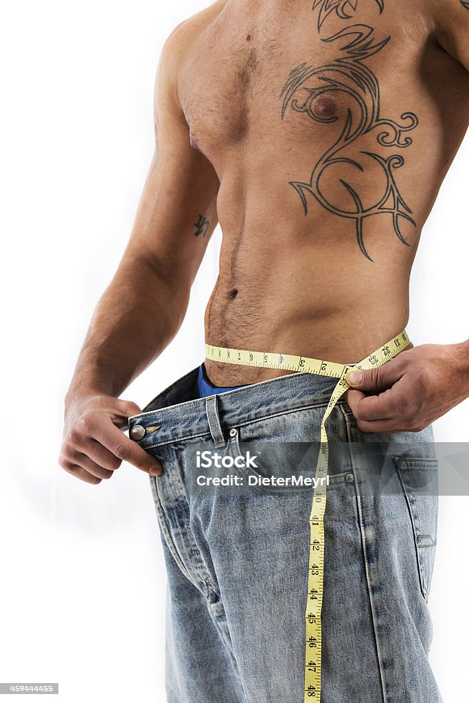 Man measuring waist Man  measuring his waist, isolated on white Abdominal Muscle Stock Photo