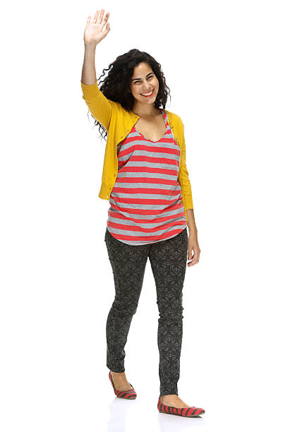 istock Smiling girl waving her hand 459445439