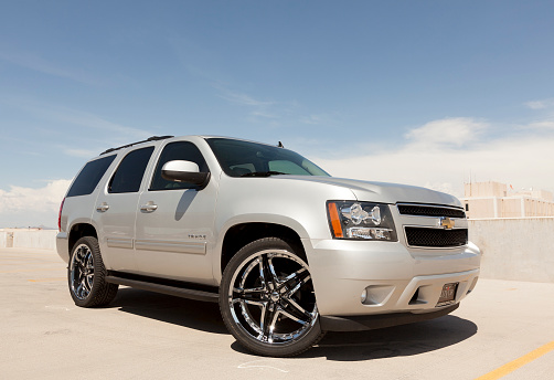 Scottsdale, United States - August 18, 2011: A photo of a silver Chevrolet Tahoe sport utility vehicle. The Tahoe is a very popular SUV in the United States.
