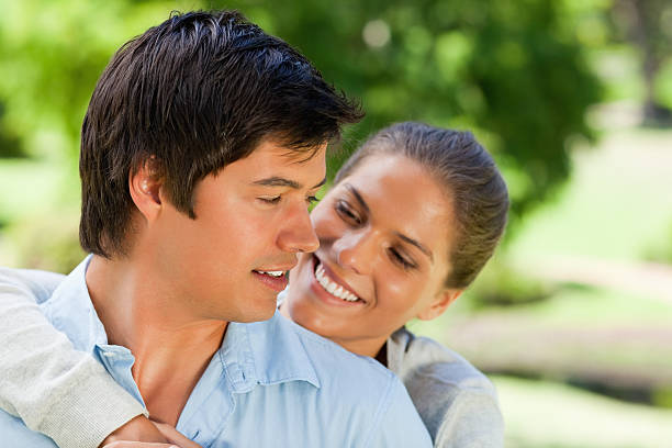 istock Young woman with her arm around boyfriend 459446493
