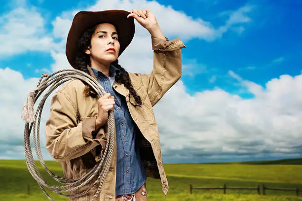 Cowgirl posing with lasso on shoulderhttp://www.twodozendesign.info/i/1.png