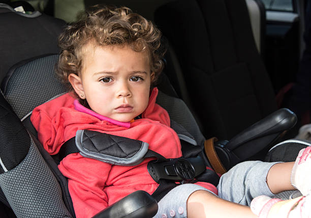 istock Little girl sitting in a minivan 459447999