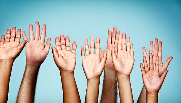 istock Put your hands up! Enthusiastically waving people 459448485
