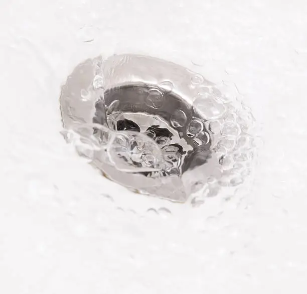 Plughole with water in square composition