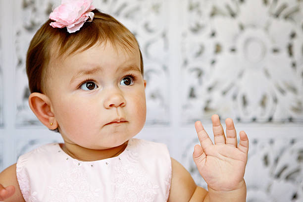 Baby Girl in Pink Dress stock photo