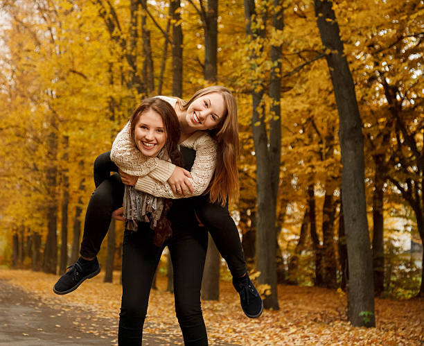 istock A girl having a piggyback ride 459456525