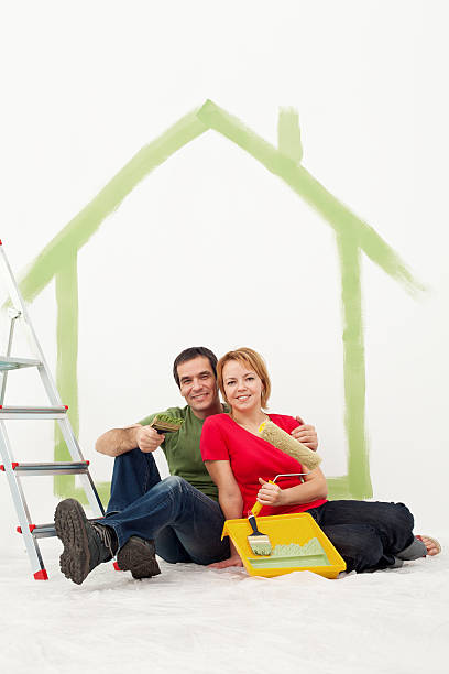 istock Couple with painting utensils resting 459463941