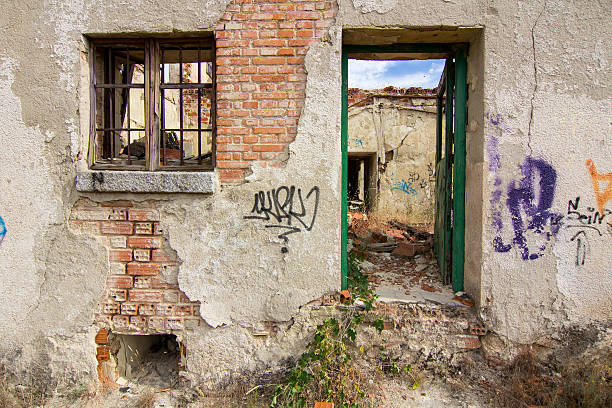 istock entrance to a ruined house 459464135