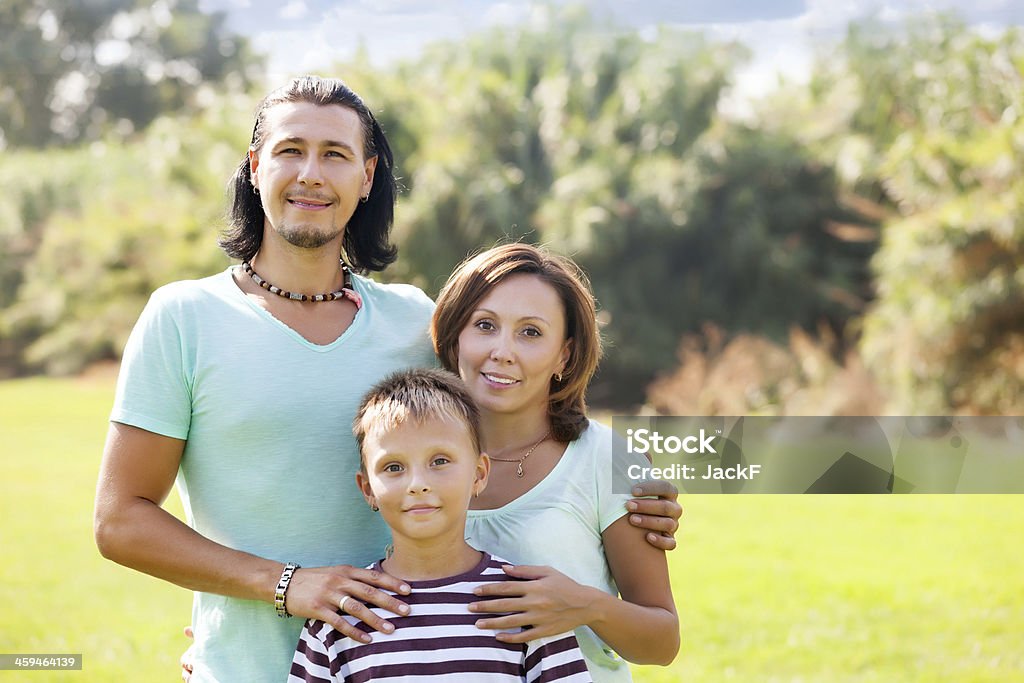 family of three Portrait of family of three in sunny summer park 10-11 Years Stock Photo