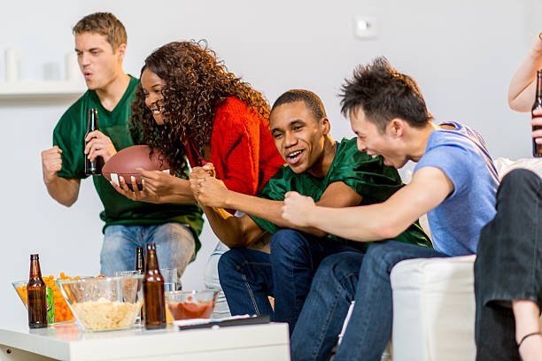 istock Young adults watching football 459464679