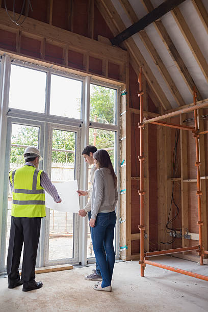 istock Architect showing couple the blueprints 459465449