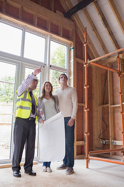 istock Architect showing couple the house 459465495