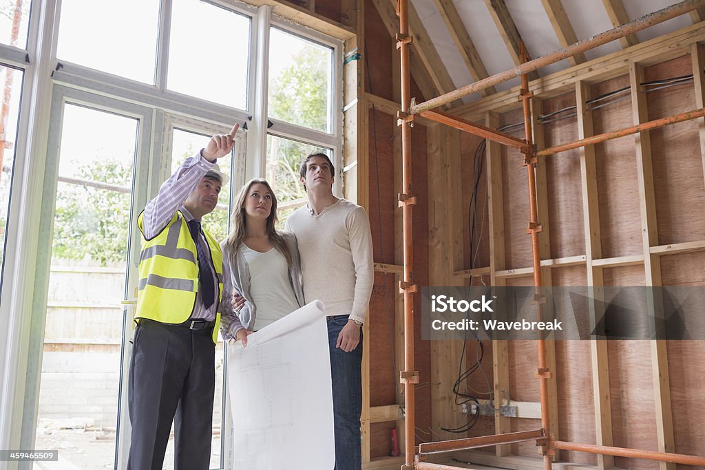 Architect showing the house Architect showing the house to the couple 20-29 Years Stock Photo