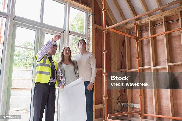 Architect Showing The House Stock Photo - Download Image Now - 20-29 Years, 50-59 Years, Adult