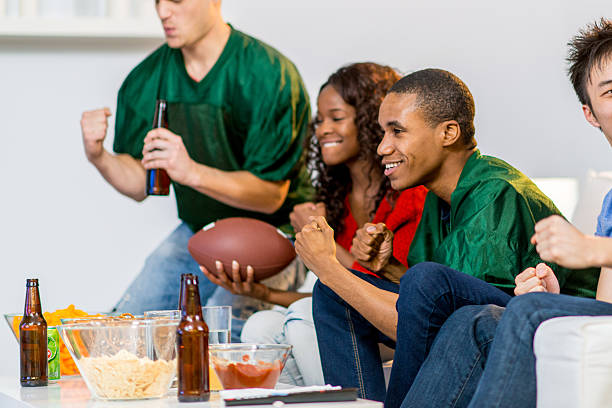 istock Young adults watching football 459465657