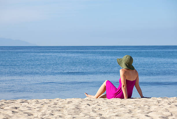 istock Woman Relaxing at the Beach 459465923