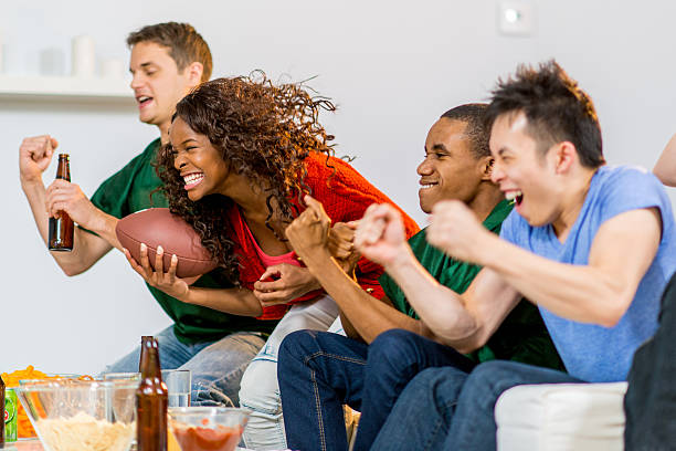 istock Young adults watching football 459465927