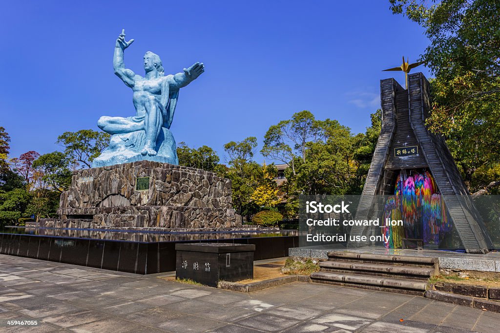 Nagasaki Peace Monument Nagasaki, Japan - November 14 2013: Nagasaki peace statue, the statue's right hand points to the thret of nuclear while the extended left hand symbolizes eternal peace Nagasaki Prefecture Stock Photo