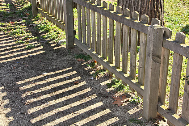istock wooden fence in garden 459468649