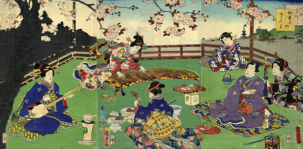 Japanese Triptych Woodblock Cherry Blossom entertainment A wonderful Triptych Ukiyo-e print for the master Kunisada Utagawa (1786-1864) started his career as the chief pupil of the head of the Utagawa school. person sitting on fence stock illustrations