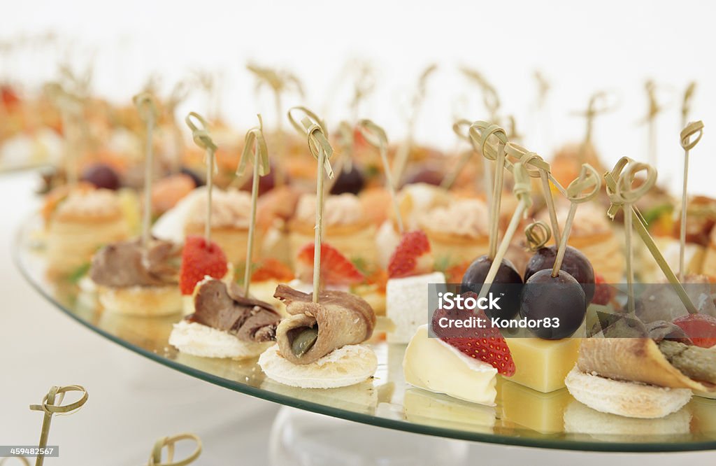 Various snacks on platter Various meat, fish and cheese banquet snacks on banquet platter Appetizer Stock Photo