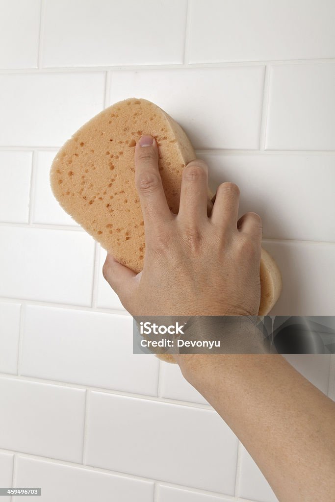 Cleaning Bathroom Tile Wall Cleaning Bathroom Tile Wall close up Bath Sponge Stock Photo