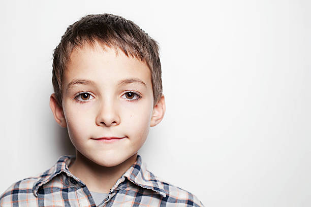 istock Young Boy Close-Up Looking at Camera with Smile 459499781
