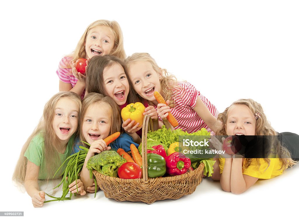 Happy children with vegetables Little girls with basket of vegetables Farmer Stock Photo