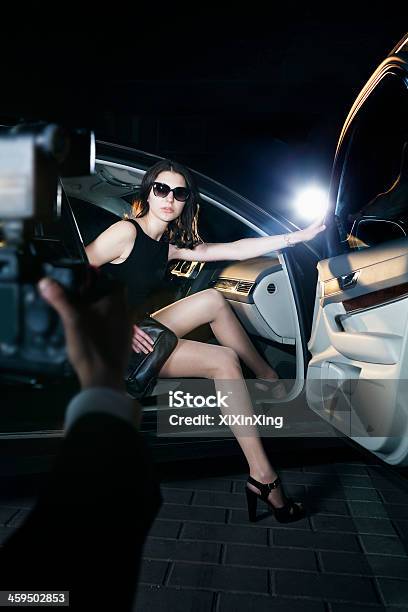 Paparazzi Photographer Taking Photo Of Woman Stock Photo - Download Image Now - Car, Disembarking, Red Carpet Event