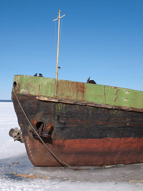 istock Old ship on the lake in winter 459503795