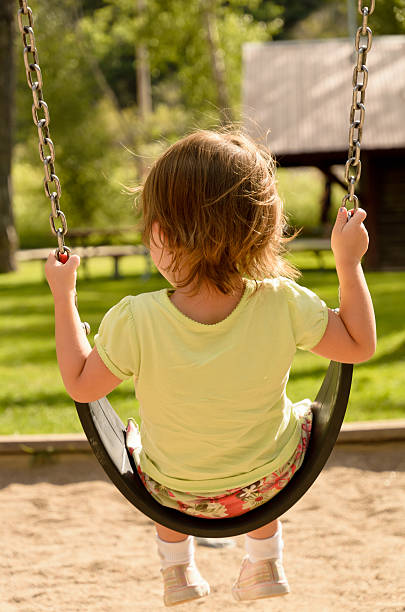 Little Girl on Swing stock photo