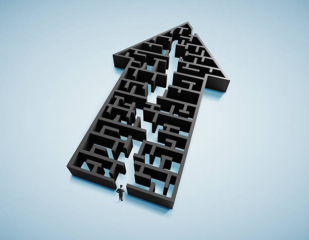 istock businessman and arrow form labyrinth 459519611