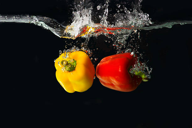 Free Stock Photo of Bell pepper splash in water on black | Download ...