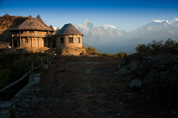 Beautiful morning view of the classic house near Himalayan mountains when see from Sarangkot, Pokhara, Nepal