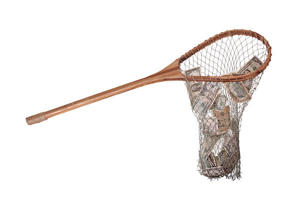istock dollars in wooden fishnet 459520995
