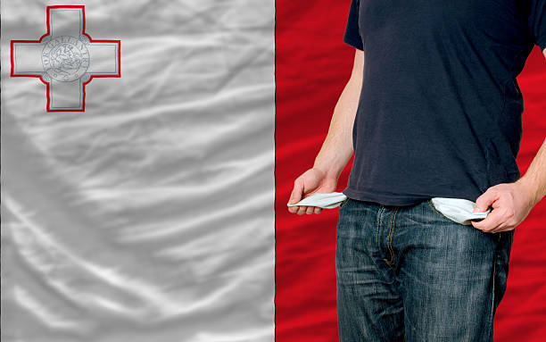 recession impact on young man and society in malta stock photo