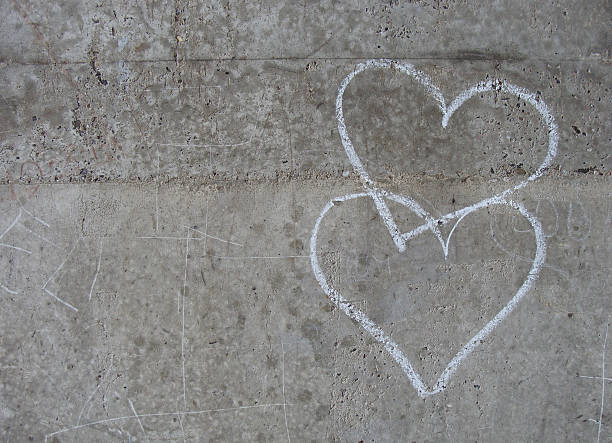 istock white chalk love hearts on a grungy gray concrete wall 459525249