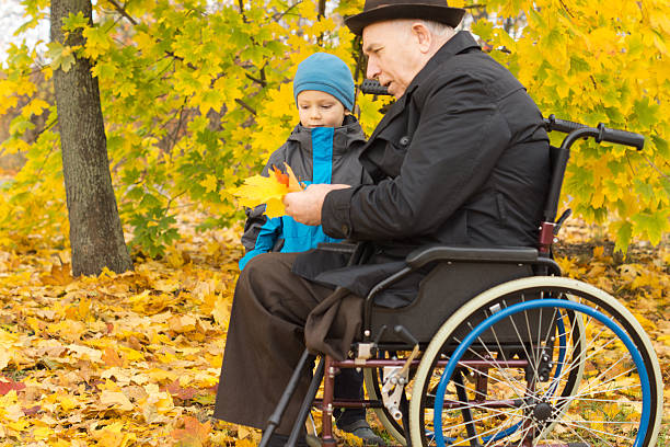 istock Disabled man and his grandson enjoying autumn 459525747