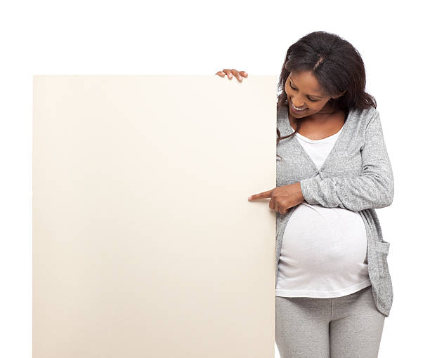 istock Pregnant woman with blank sign. 459526459