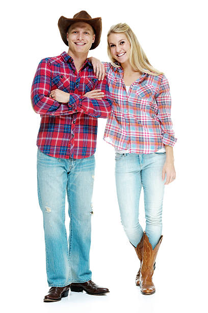 istock Happy cowboy couple posing together 459526963