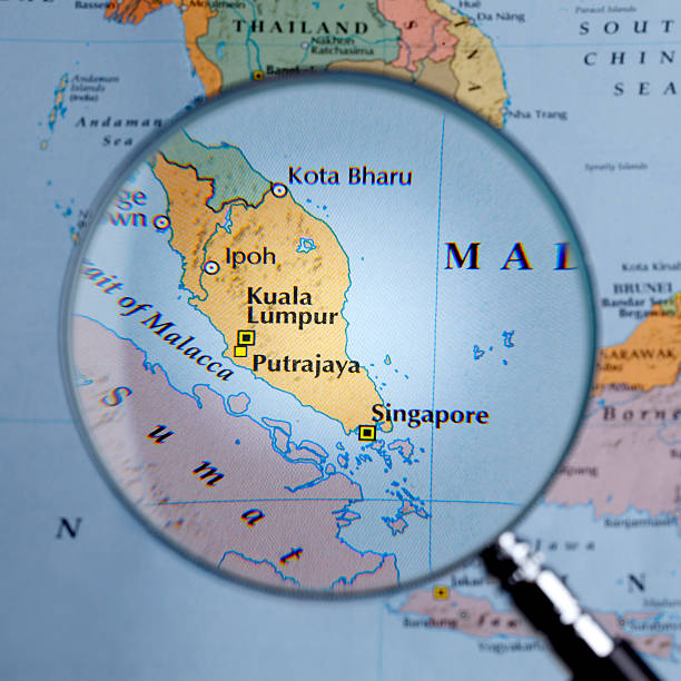 istock Magnifying glass over a map of Singapore 459527127