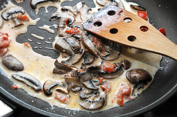 istock Cooking mushrooms and tomatoes souse 459537611
