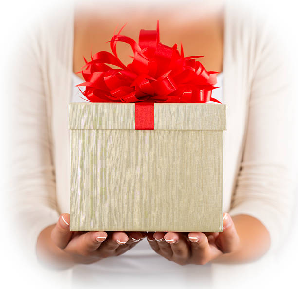 istock Female hands holding gift with ribbon. 459568339